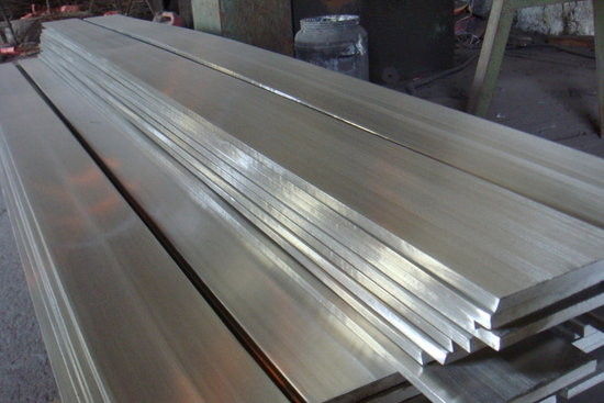 pile of flat sheet metal bars for fabrication